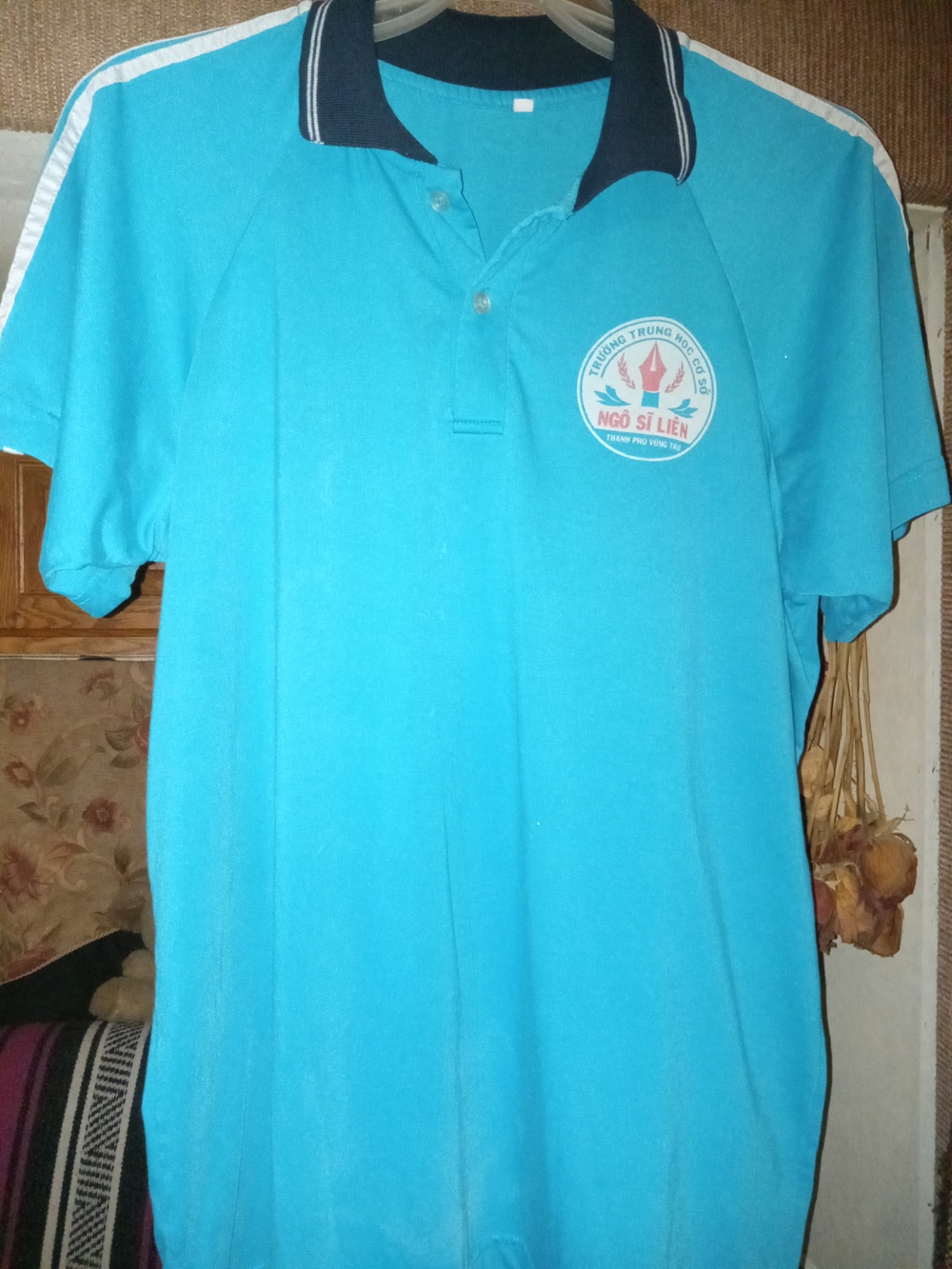 This is a blue shirt featuring the logo for Ngo Si Lien Secondary School in Vung
